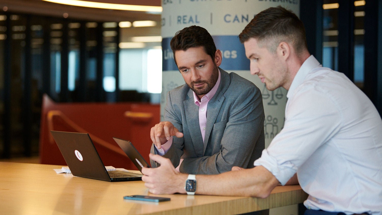 Two brokers learning about cyber security