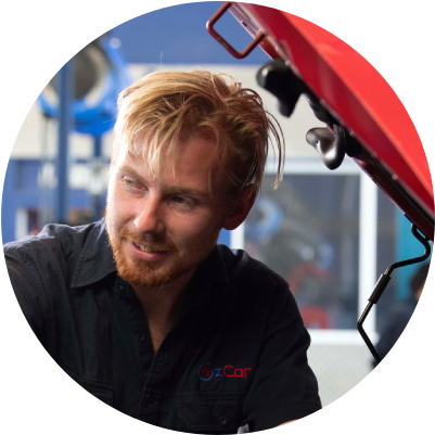 Guy smiles while working on his truck business